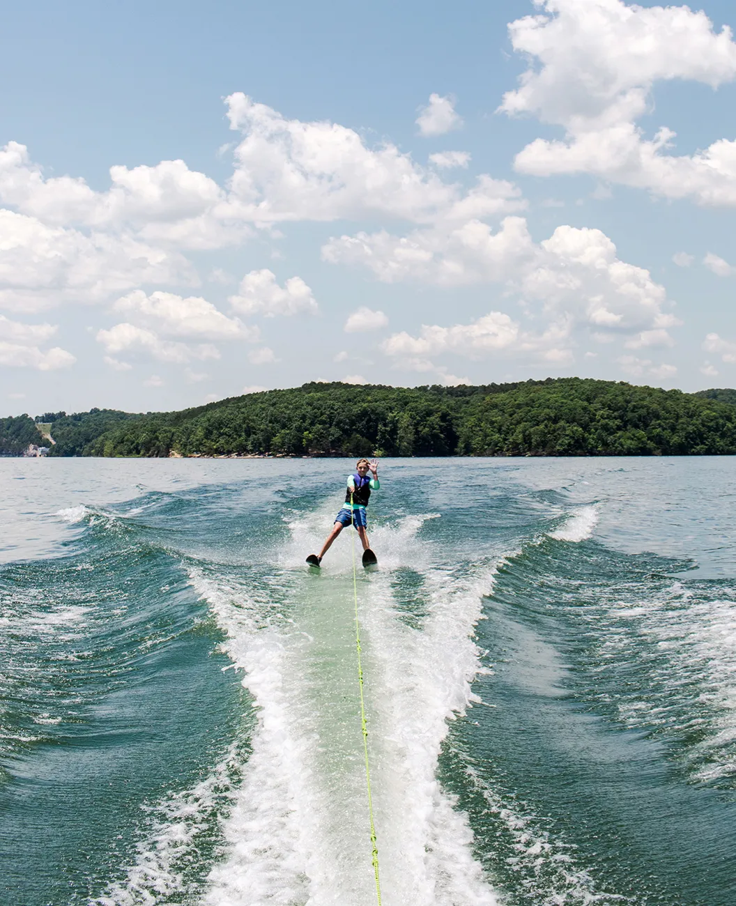 Person Waterskiing on Lake